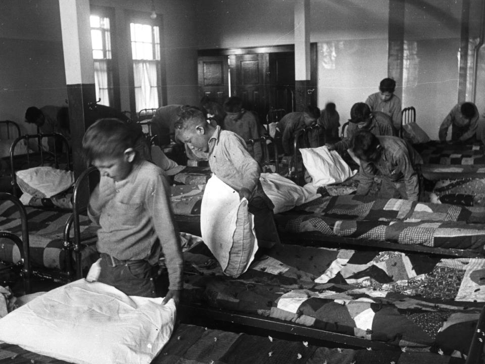 1950: North American Indian children in their dormitory at a Canadian boarding school.