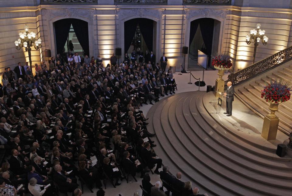 People listen to Ali Suleiman Aujali, the Libyan Ambassador to the United States during a public memorial in honor of slain U.S. Ambassador J. Christopher Stevens in the rotunda at City Hall in San Francisco, Tuesday, Oct. 16, 2012. Stevens, 52, and three other Americans were killed Sept. 11 when gunmen attacked the United States Mission in Benghazi, Libya. (AP Photo/Eric Risberg)