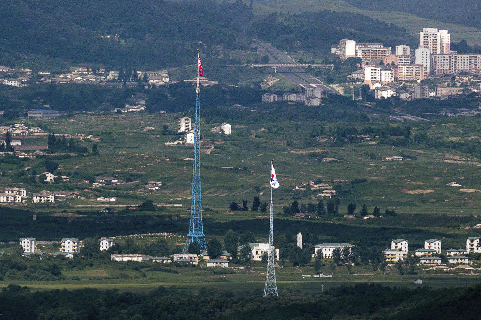 Flags of North Korea, rear, and South Korea, front, are seen from the border area between two Koreas in Paju, South Korea, Tuesday, Aug. 16, 2022. The United States and South Korea will begin their biggest combined military training in years next week in the face of an increasingly aggressive North Korea, which has been ramping up weapons tests and threats of nuclear conflict against Seoul and Washington, the South's military said Tuesday. (Im Byung-shik/Yonhap via AP)