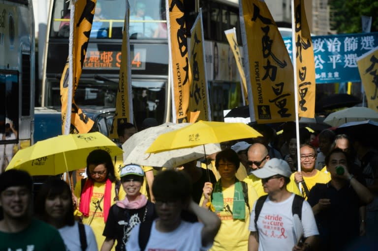 Hundreds of protesters on August 21, 2016 marched over the Hong Kong government's ban on pro-independence candidates from running in the city's upcoming legislative election, as fears grow over Beijing's influence in the city