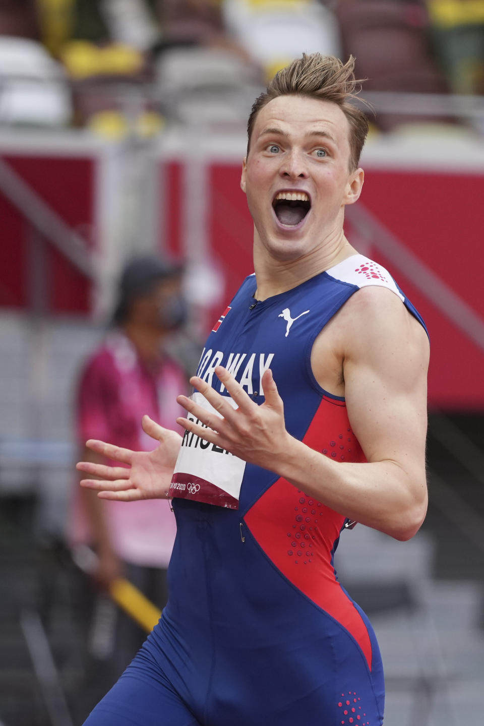 Karsten Warholm, of Norway, celebrates after winning the gold medal in the men's 400-meter hurdles at the 2020 Summer Olympics, Tuesday, Aug. 3, 2021, in Tokyo.(AP Photo/David J. Phillip)