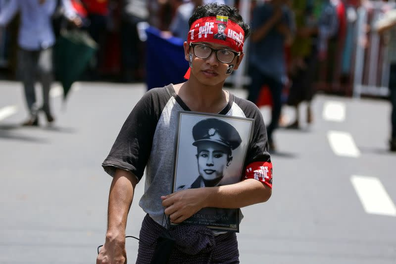 Supporter holds a portrait of General Aung San to mark the 72nd anniversary of Martyrs' Day in Yangon