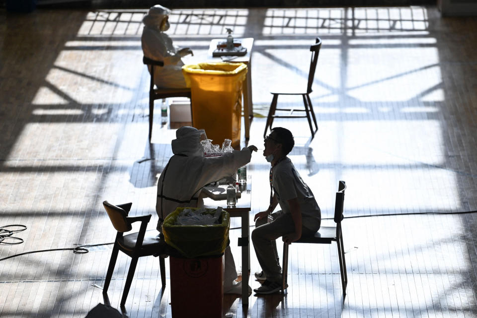Image: A person is given a test for the coronavirus in Wuhan, China  (AFP - Getty Images)