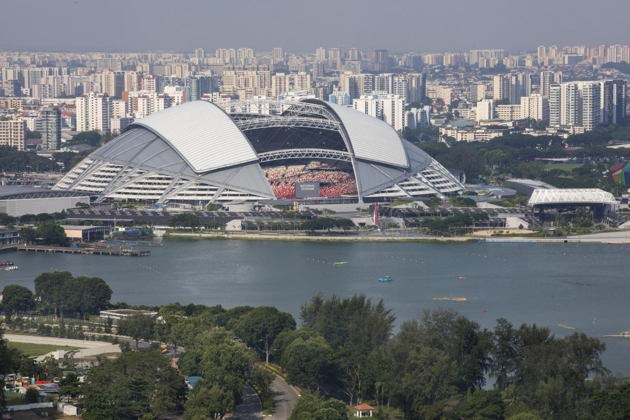 The Singapore Sports Hub seen with the Kallang River in the foreground.  
