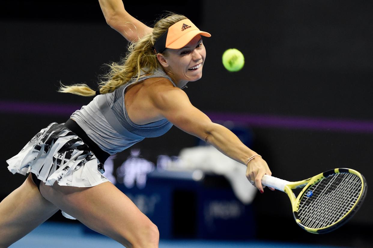 Caroline Wozniacki of Denmark hits a return during her women's singles semi-final match against Naomi Osaka of Japan at the China Open tennis tournament in Beijing on October 5, 2019. (Photo by Leo RAMIREZ / AFP) (Photo by LEO RAMIREZ/AFP via Getty Images)