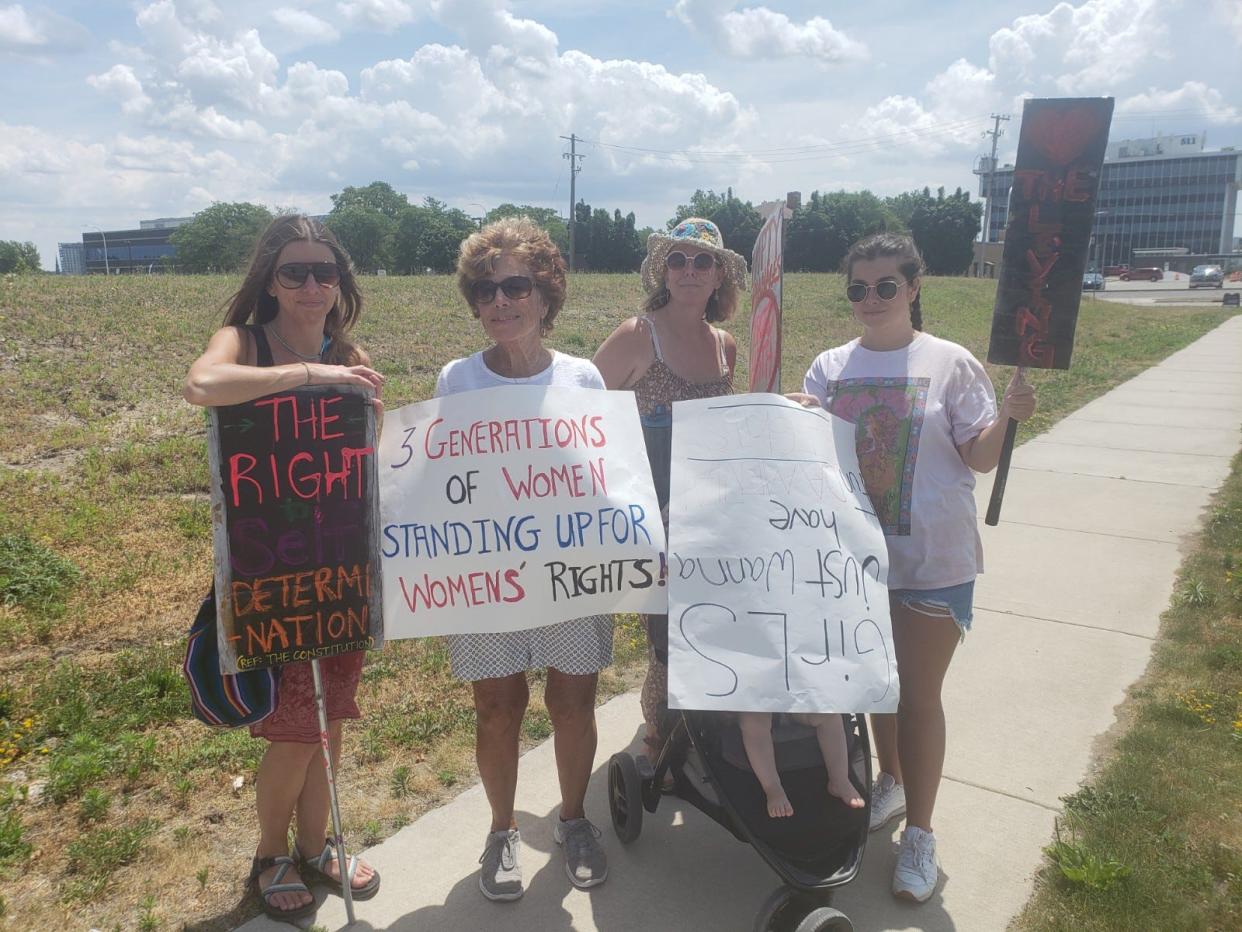 Michaele Suisse, Bonnie Hartman, Marci Dambacher and Alayna McDonald attend a demonstration supporting abortion rights in Port Huron on Saturday, July 2, 2022.