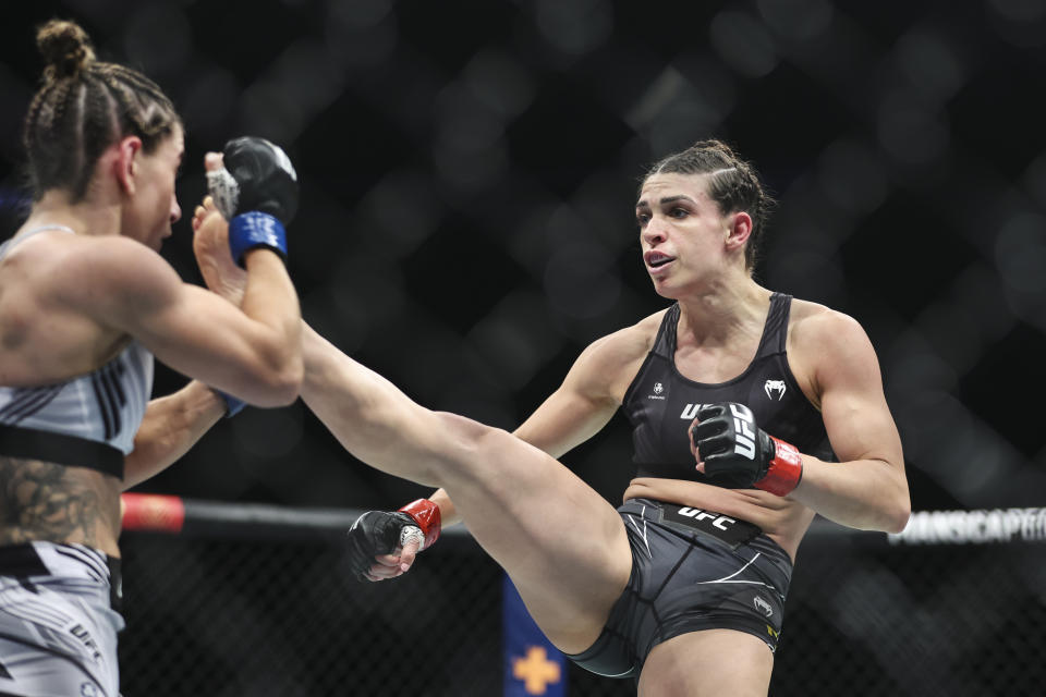 JACKSONVILLE, FLORIDA - APRIL 09: Mackenzie Dern kick Tecia Torres in their strawweight fight during the UFC 273 event at VyStar Veterans Memorial Arena on April 09, 2022 in Jacksonville, Florida. (Photo by James Gilbert/Getty Images)