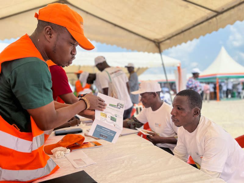 Ivory Coast gives cocoa farmers electronic cards to track beans, ensure fair price in Agboville