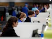 Airlines staff work as tourists at Gran Canaria airport return to their countries after closure of hotels