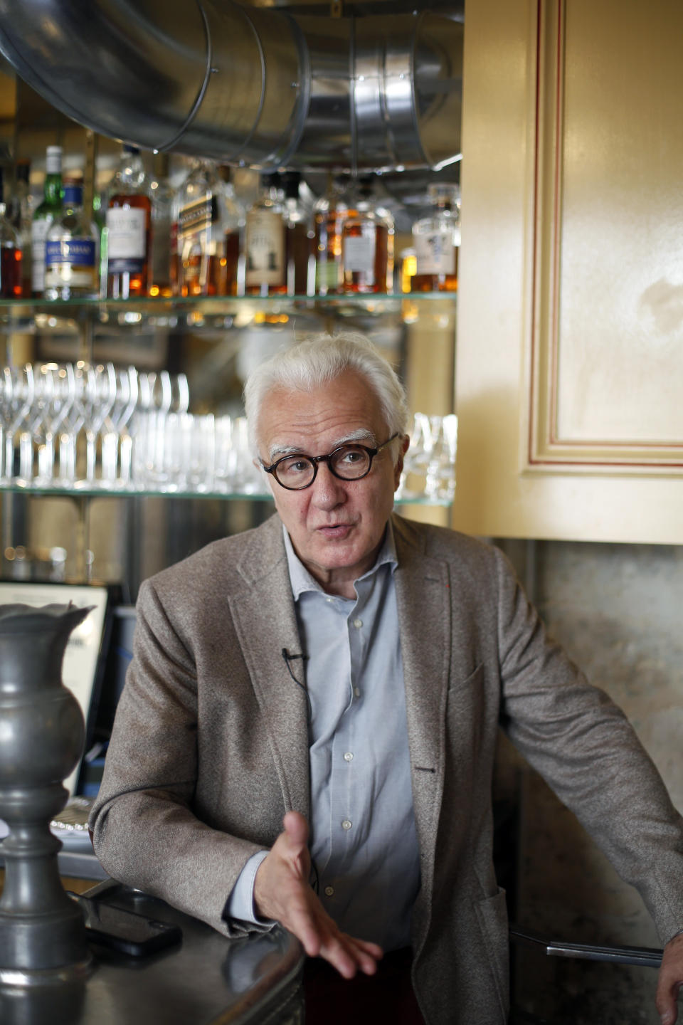 French chef Alain Ducasse speaks to Associated Press reporters during an interview, in Paris, Thursday, June 11, 2020. French Michelin-starred chef Alain Ducasse unveils virus-protection measures as he prepares to reopen his restaurants, including a new filtration system that works to stop virus particles from the air traveling to neighboring tables. (AP Photo/Thibault Camus)