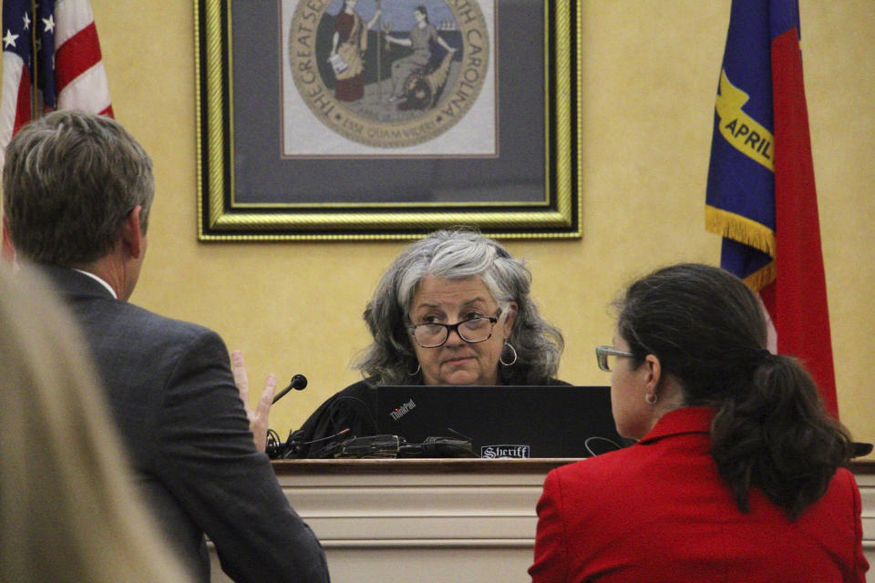 Superior Court Judge Sherri Murrell, center, speaks with Orange County District Attorney Jeff Nieman and public defender Dana Graves, Tuesday, Aug. 29, 2023, in Hillsborough, N.C, during the first court appearance of Tailei Qi. Qi is accused of fatally shooting his faculty adviser at UNC-Chapel Hill. (AP Photo/Hannah Schoenbaum)