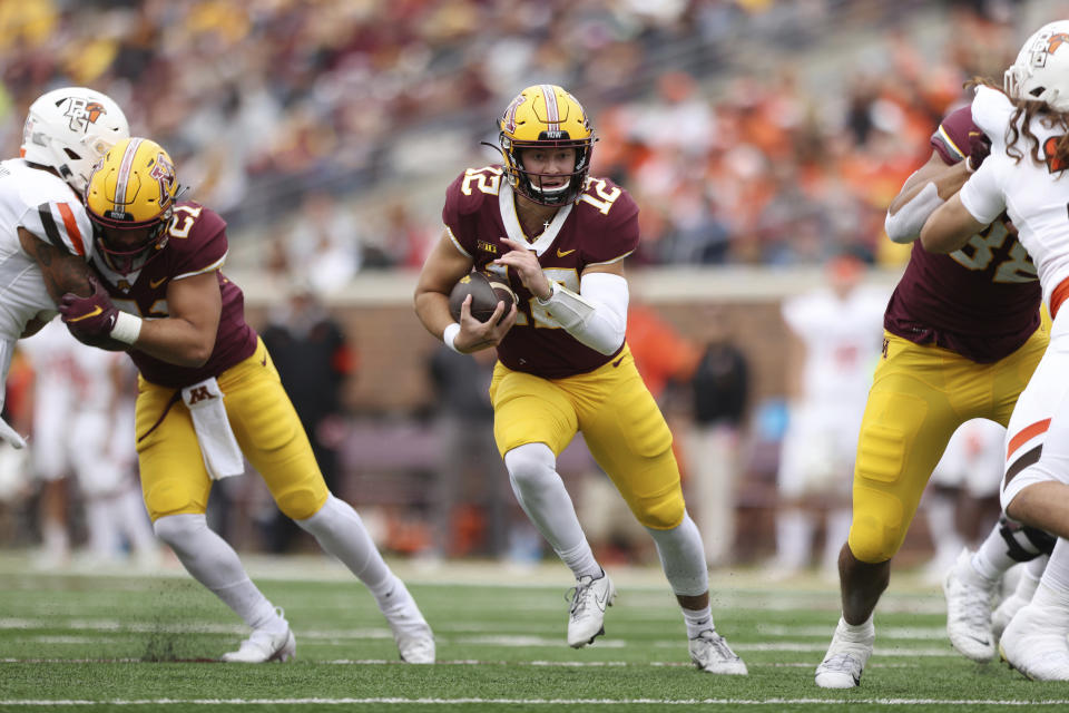 Minnesota quarterback Cole Kramer (12) runs with the ball during the second half of an NCAA college football game against Bowling Green, Saturday, Sept. 25, 2021, in Minneapolis. Bowling Green won 14-10. (AP Photo/Stacy Bengs)