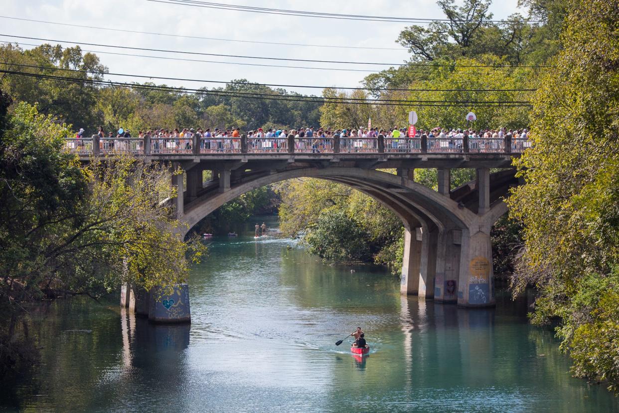 The line to enter the Austin City Limits Music Festival stretches down Barton Springs Road and out onto the bridge over Barton Creek in 2017. The City Council approved a design plan for the replacement of the bridge Thursday.