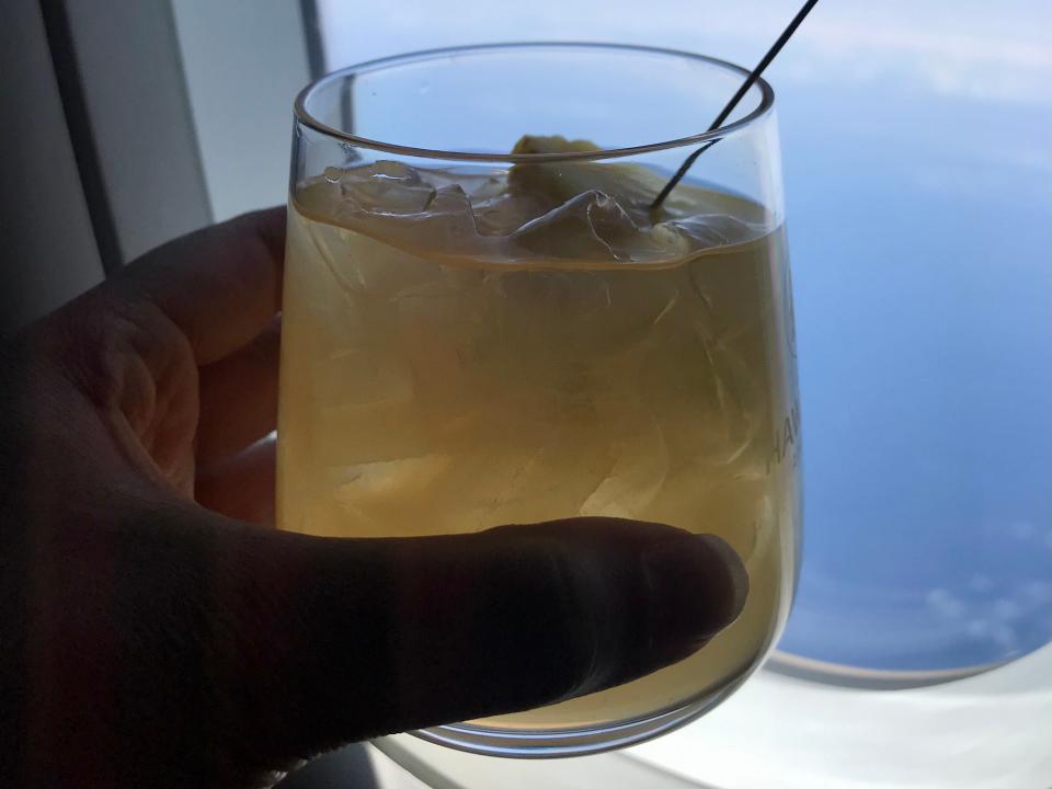 cocktail in front of airplane window