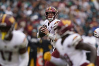 Washington Commanders quarterback Carson Wentz (11) looking to pass the ball against the Philadelphia Eagles during the second half of an NFL football game, Sunday, Sept. 25, 2022, in Landover, Md. (AP Photo/Susan Walsh)