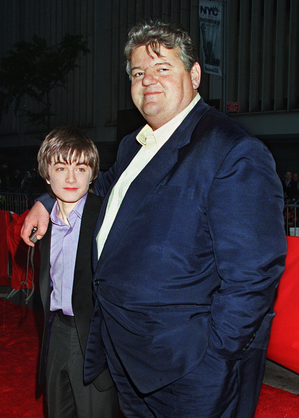 FILE - Daniel Radcliffe, left, who plays Harry Potter in the new movie "Harry Potter and the Sorcerer's Stone," and Robbie Coltrane, who plays Hagrid in the film, arrive for the film's New York premiere on Nov. 11, 2001. Coltrane, who played a forensic psychologist on TV series “Cracker” and Hagrid in the “Harry Potter” movies, has died. Coltrane’s agent Belinda Wright said he died Friday at a hospital in Scotland. He was 72. (AP Photo/Darla Khazei, File)