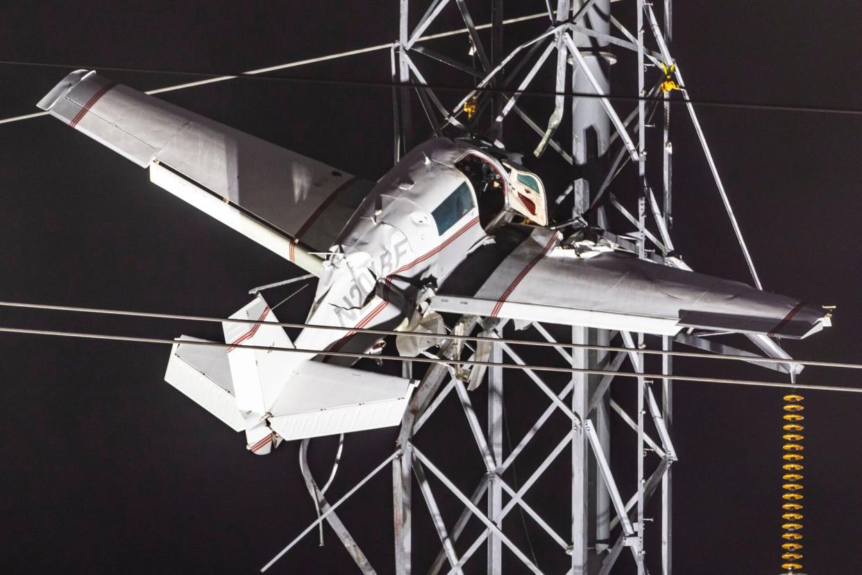 A small plane remains stuck after it crashed into power lines, knocking out electricity for tens of thousands of residents, in Gaithersburg, Maryland, USA, 28 November 2022. The pilot and and one passenger were rescued. Small plane crashes into power lines in Maryland, Gaithersburg, USA - 28 Nov 2022