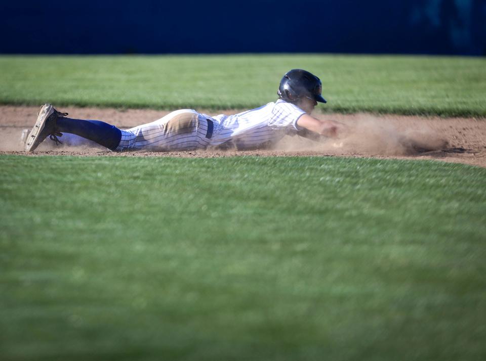 Blanchet Catholic's Nate Rauch (17) slides back to second base during the game against Kennedy on Wednesday, May 8, 2024 in Salem, Ore.