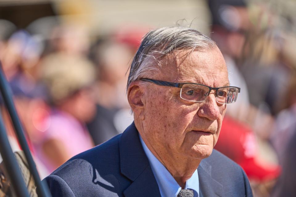 Former Maricopa County Sheriff Joe Arpaio walks past the media during former President Donald Trump's rally at Legacy Sports Park in Mesa on Oct. 9, 2022.