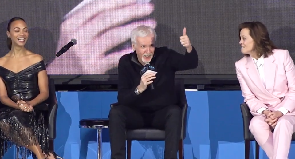 James Cameron gives a thumbs up during the press conference. 