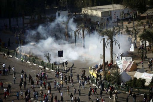 Riot police fire tear gas on Cairo's Tahrir Square during clashes with protesters. A divisive panel boycotted by liberals and Christians was set to rush out a draft new Egyptian constitution on Wednesday as protests mounted over the political future nearly two years after Hosni Mubarak's overthrow