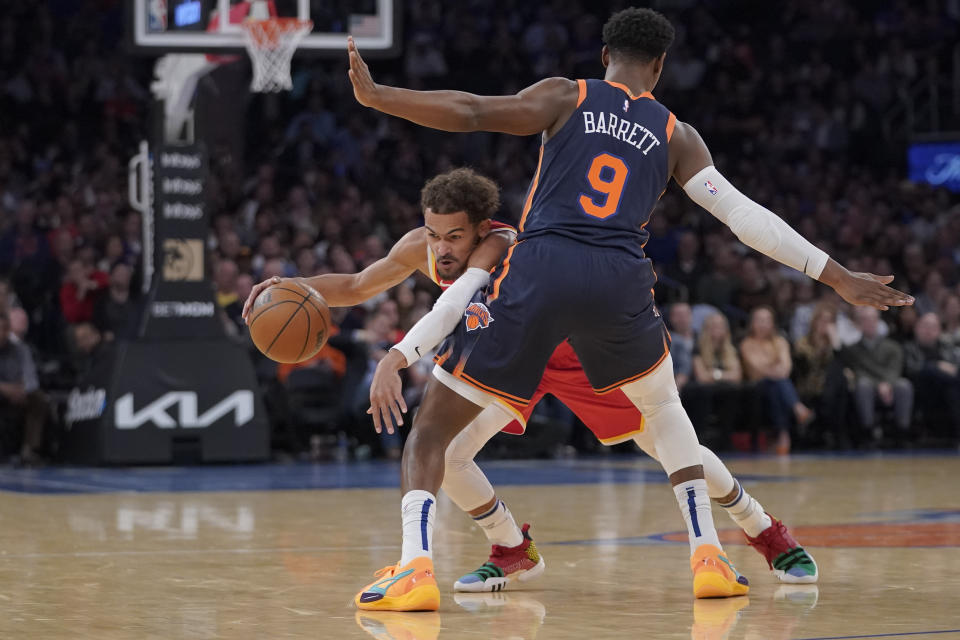 New York Knicks guard RJ Barrett (9) guards Atlanta Hawks guard Trae Young during the first half of an NBA basketball game Wednesday, Nov. 2, 2022, at Madison Square Garden in New York. (AP Photo/Mary Altaffer)