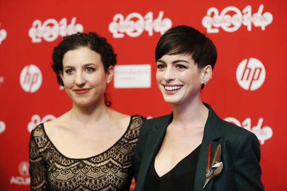 Writer and director Kate Barker-Froyland, left, and cast member Anne Hathaway, right, pose together at the premiere of the film "Song One" during the 2014 Sundance Film Festival, on Monday, Jan. 20, 2014, in Park City, Utah. (Photo by Danny Moloshok/Invision/AP)