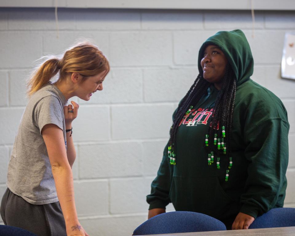 Sophomores Eva Failer and Julissia Rogers talk through things they have in common during a warmup exercise for Highland Park's Girl Up at the club's meeting Thursday morning.