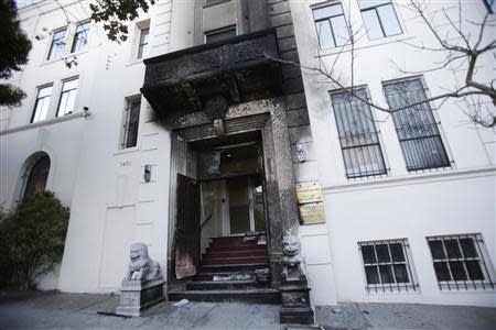 The damaged entrance of the Chinese consulate is seen after an unidentified person set fire to the main gate in San Francisco, California January 2, 2014. REUTERS/Stephen Lam