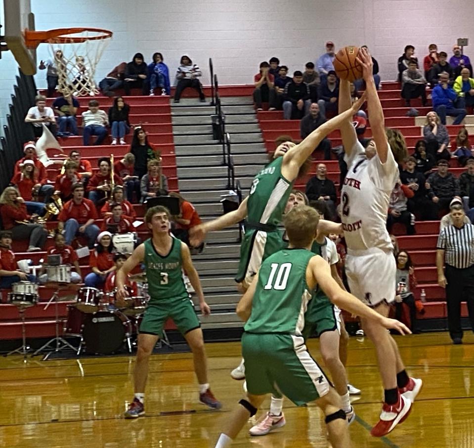 South Beloit 6-8 junior Ross Robertson grabs one of his 13 rebounds against No. 5-ranked Scales Mound on Thursday, Dec. 14 at South Beloit.