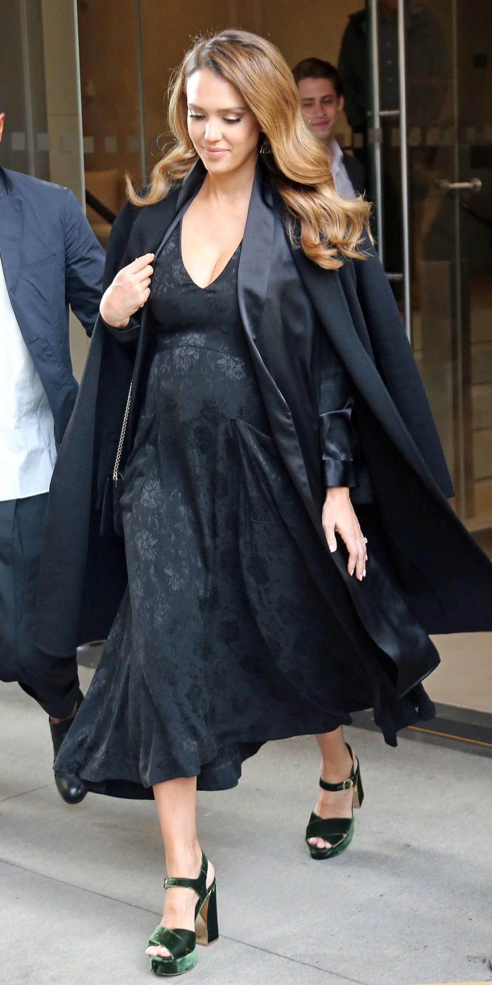 <p>The expectant mom stepped out for NYFW on Thursday in a plunging black Creatures of Comfort dress topped with a long black coat and velvet green platform heels. Her hair, though, is what really had us talking: The star's shiny curls gave new meaning to "pregnancy glow."</p>