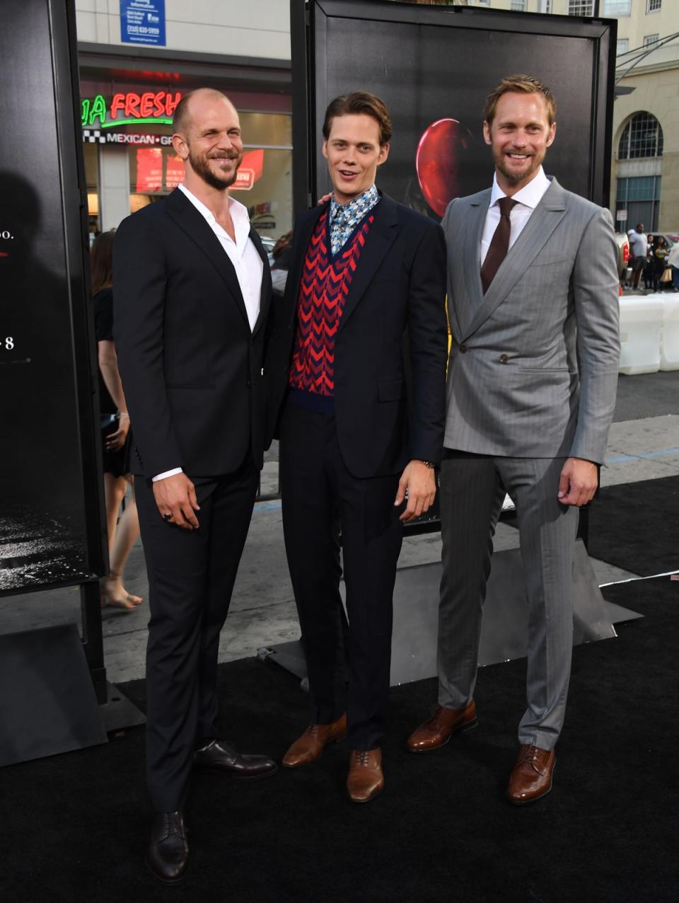 Gustaf Skarsgard (L), Bill Skarsgard (C) and Alexander Skarsgard (AFP via Getty Images)