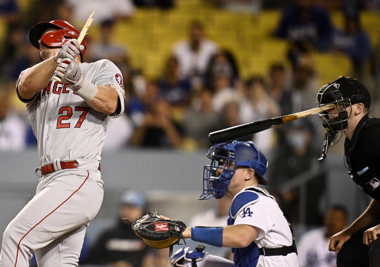 Los Angeles, CA - June 14:  Home plate umpire Nate Tomlinson is hit in the face by a broken bat from Mike Trout #27 of the Los Angeles Angels as catcher Will Smith #16 of the Los Angeles Dodgers looks on in the ninth inning of a MLB baseball game at Dodger Stadium in Los Angeles on Tuesday, June 14, 2022. (Photo by Keith Birmingham/MediaNews Group/Pasadena Star-News via Getty Images)