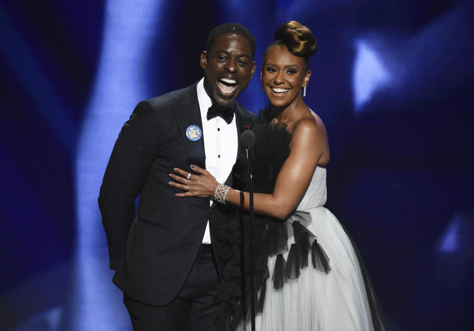 Sterling K. Brown, left, and Ryan Michelle Bathe speak on stage at the 51st NAACP Image Awards at the Pasadena Civic Auditorium on Saturday, Feb. 22, 2020, in Pasadena, Calif. (AP Photo/Chris Pizzello)