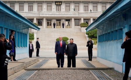 FILE PHOTO: Trump meets with North Korean leader Kim Jong Un at the DMZ on the border of North and South Korea