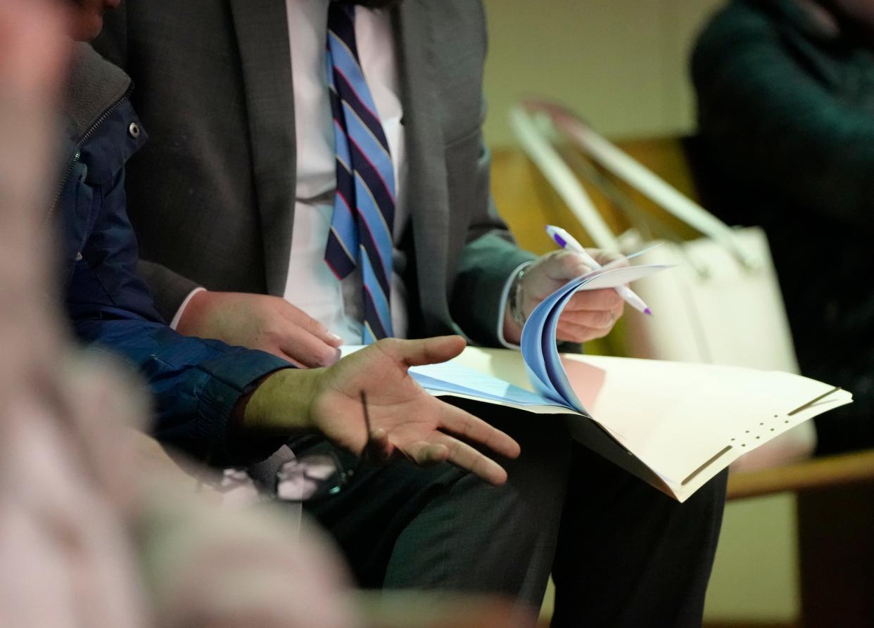 An attorney speaks with a client during proceedings in Franklin County Municipal Court's Eviction Court, where magistrates hear dozens of cases per day after the county saw a 20-year high in filings in 2023.