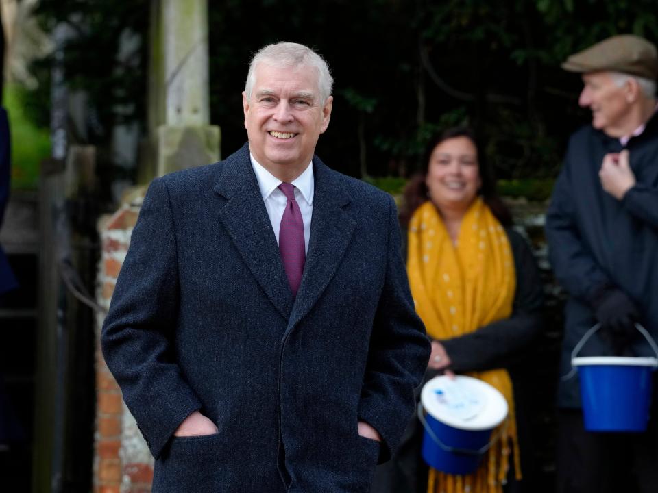 Prince Andrew smiles at Sandringham on Christmas