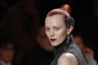 A model wears a creation as part of the Fendi Fall/Winter 2020 collection, presented in Milan, Italy, Thursday, Feb. 20, 2020. (AP Photo/Antonio Calanni)