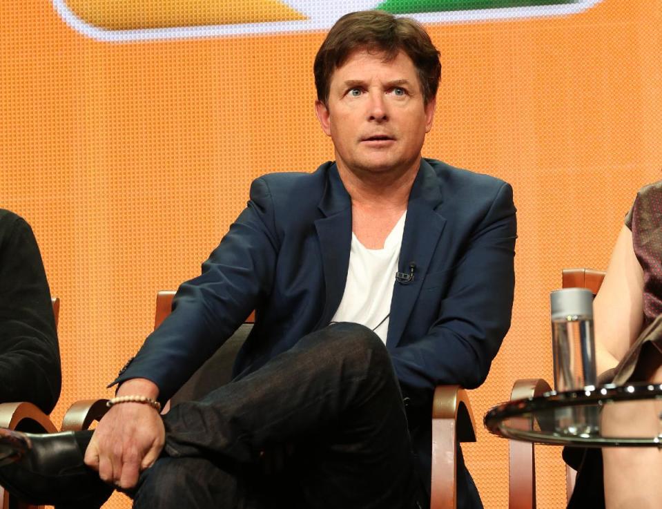 FILE - This July 27, 2013 file publicity image released by NBC shows actor Michael J. Fox from the "The Michael J. Fox Show" panel during the NBCUniversal Press Tour in Beverly Hills, Calif. Fox will star as Mike Henry, a former local NBC newscaster with Parkinson’s. (AP Photo/NBC, Chris Haston)