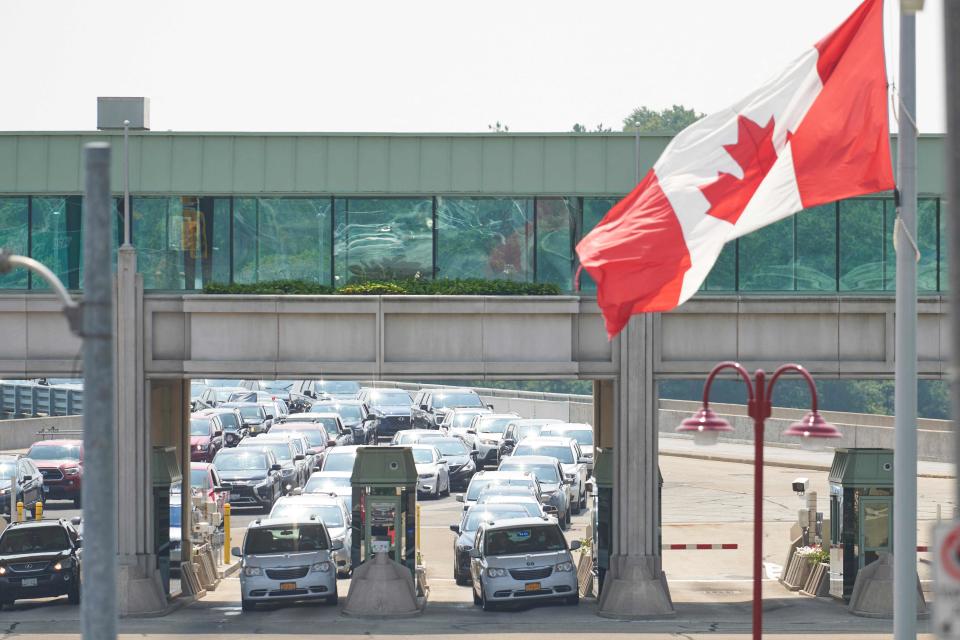 The Centers for Disease Control and Prevention and U.S. State Department downgraded their travel advisories for Canada. In this photo, travelers wait to cross into Canada at the Rainbow Bridge in Niagara Falls, Ontario on Aug. 9, 2021, the day Canada reopened for nonessential travel to fully vaccinated Americans.