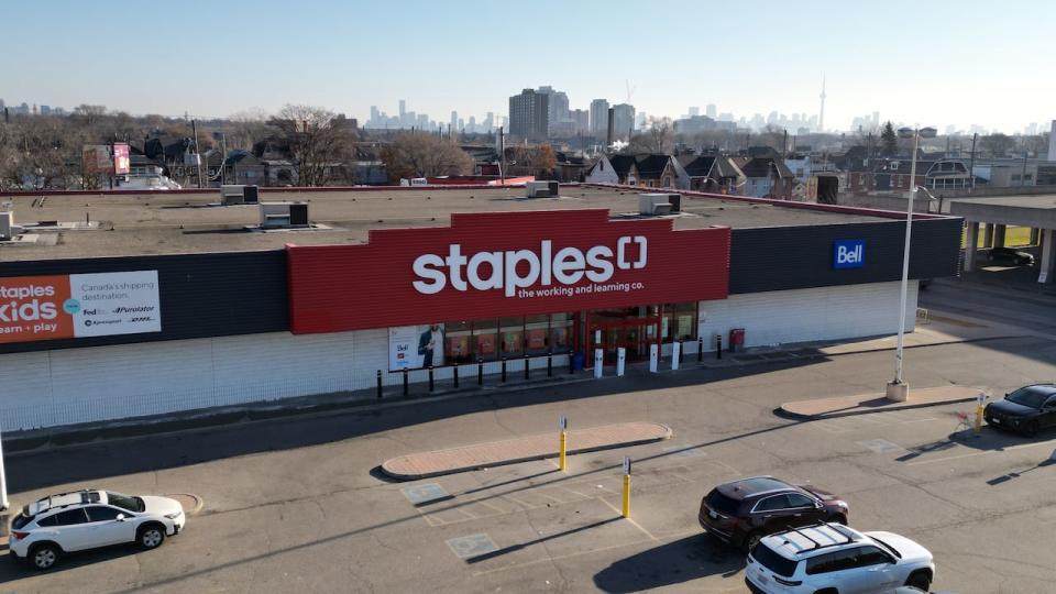 Aerial (drone) images of retails stores in the 'Stockyards' shopping complex in the Junction of Toronto. Includes Home Depot, Staples, Rona, Canadian Tire, Best Buy, Winners, Marshalls and empty store front with 'For Lease' signage.