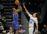 Charlotte Hornets guard Terry Rozier (3) shoots over Orlando Magic guard Cole Anthony (50) during the first half of an NBA basketball game on Friday, Jan. 14, 2022, in Charlotte, N.C. (AP Photo/Rusty Jones)