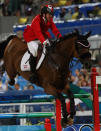 HONG KONG, CHINA - AUGUST 18: Jill Henselwood of Canada and Special Ed jump the last fence in the jump off against the United States during the Team Jumping Competition held at the Hong Kong Olympic Equestrian Venue in Sha Tin during day 10 of the Beijing 2008 Olympic Games on August 18, 2008 in Hong Kong, China. (Photo by Julian Herbert/Getty Images)