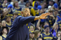 Michigan head coach Juwan Howard signals from the sideline during the first half of an NCAA college basketball game against Ohio State, Sunday, Feb. 5, 2023, in Ann Arbor, Mich. (AP Photo/Carlos Osorio)