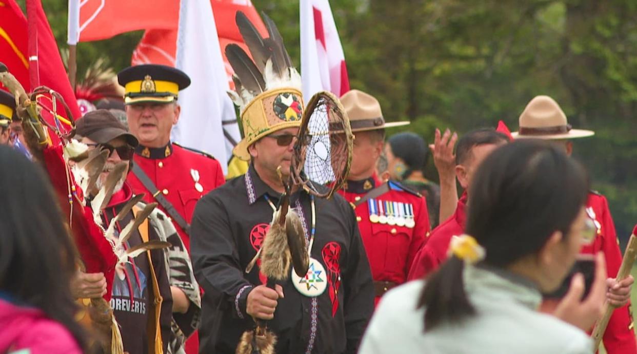 Chief Roddy Junior Gould, centre, is shown at an Abegweit First Nation Mawi'omi event in Scotchfort, P.E.I., in June 2023. (Sheehan Desjardins/CBC - image credit)