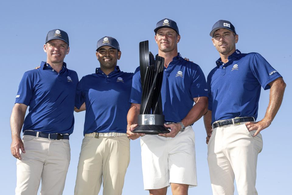From left to right, Team Champions Paul Casey, Anirban Lahiri, Bryson Dechambeau and Charles Howel III, of Crushers GC, pose with the Event Team Champion Trophy after the final round of LIV Golf Jeddah at Royal Greens Golf & Country Club, Sunday, March 3, 2024, in King Abdullah Economic City, Saudi Arabia. (Charles Laberge/LIV Golf via AP)