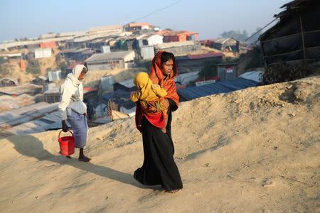 Rohingya refugees walk at Jamtoli camp in the morning in Cox's Bazar, Bangladesh, January 22, 2018. REUTERS/Mohammad Ponir Hossain