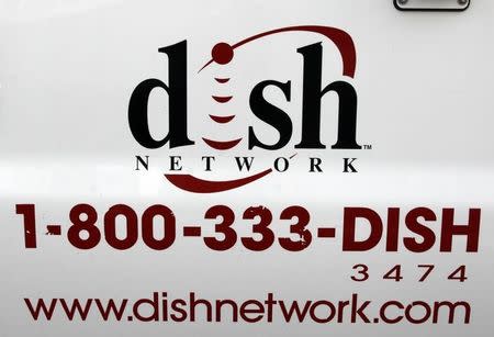 The Dish Network logo on the side of installers truck is seen in Denver March 2, 2009. REUTERS/Rick Wilking