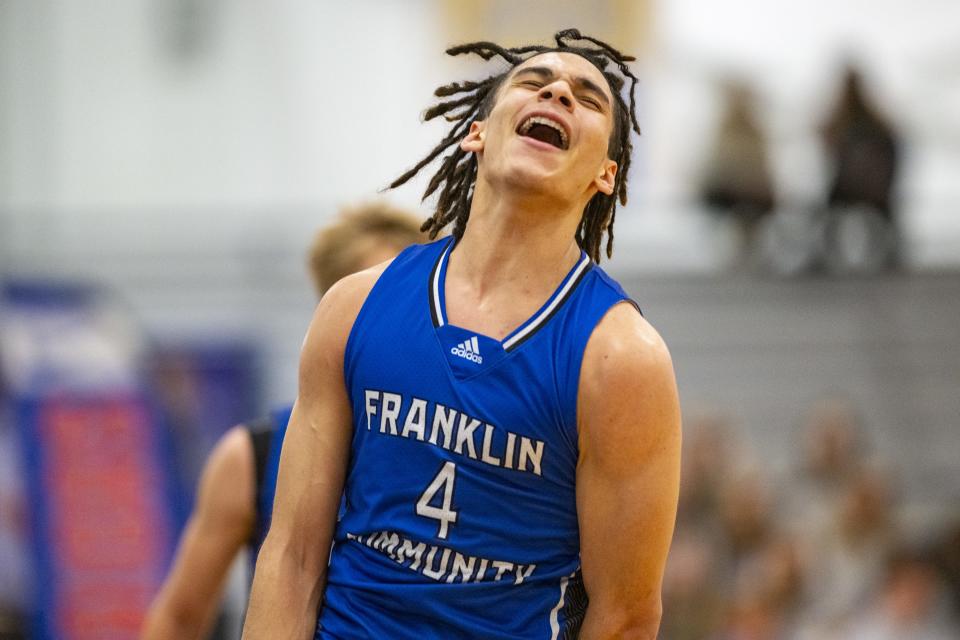 Franklin Community High School senior Micah Davis (4) reacts after hitting a buzzer-beater to end the first half of an IHSAA basketball game against Whiteland High School, Tuesday, Jan. 9, 2024, at Whiteland High Schooll.