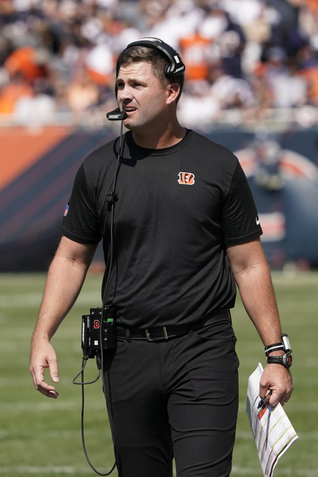 Chicago Bears quarterback Andy Dalton walks to the locker room with an  unidentified trainer during the first half of an NFL football game against  the Cincinnati Bengals Sunday, Sept. 19, 2021, in